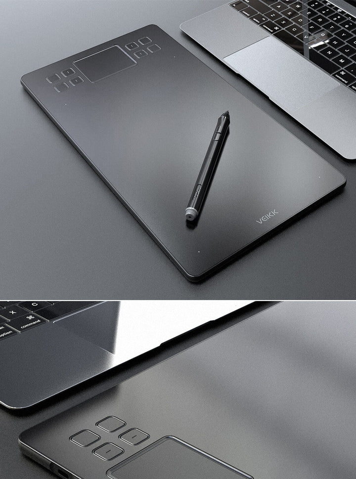 Czarny tablet graficzny z piórkiem na biurku
